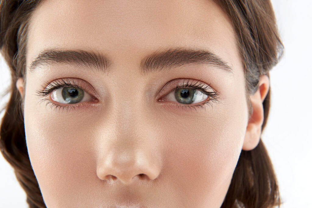 Closeupportraitofyoungprettybrunetteladywithnude | Cornerstone Plastic Surgery Brow Lift
