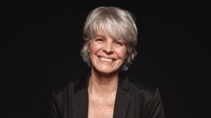 Seniorwomanwithwhitehairlaughingwhilelookingatcamera | Cornerstone Plastic Surgery 