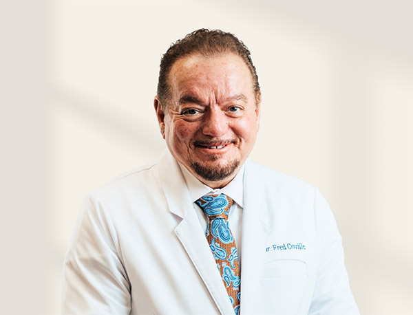 Liquid Facelift: A Non-Surgical Refresh expert plastic surgeon in white coat smiling at camera